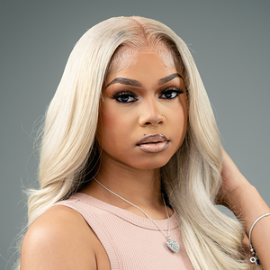 Stunning model showcasing HD #613 13X6 Lace Frontal Blonde Wig, emphasizing its beauty and 200% density.
