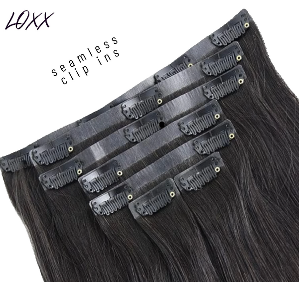 Seamless clip-in hair extensions with thin PU weft in natural black color for a comfortable, invisible look.