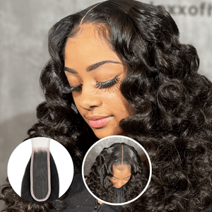 Close-up of a woman with curly hair wearing a 2x6 HD lace closure in natural black, showcasing its seamless blend and natural look.
