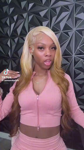 Influencer wearing Itty X Romanjay Fall Color Wig, styled in a pink outfit against a geometric background.