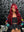 Influencer Itty showcasing the Itty X Romanjay Fall Color Wig in vibrant red curls, styled for a fashionable look.