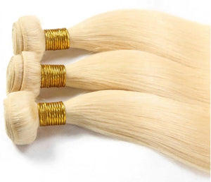 Blonde bundles featuring 100% processed raw human hair with a smooth texture and golden wefts.